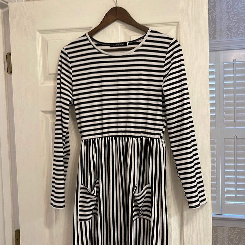 Black and white striped knee length dress.